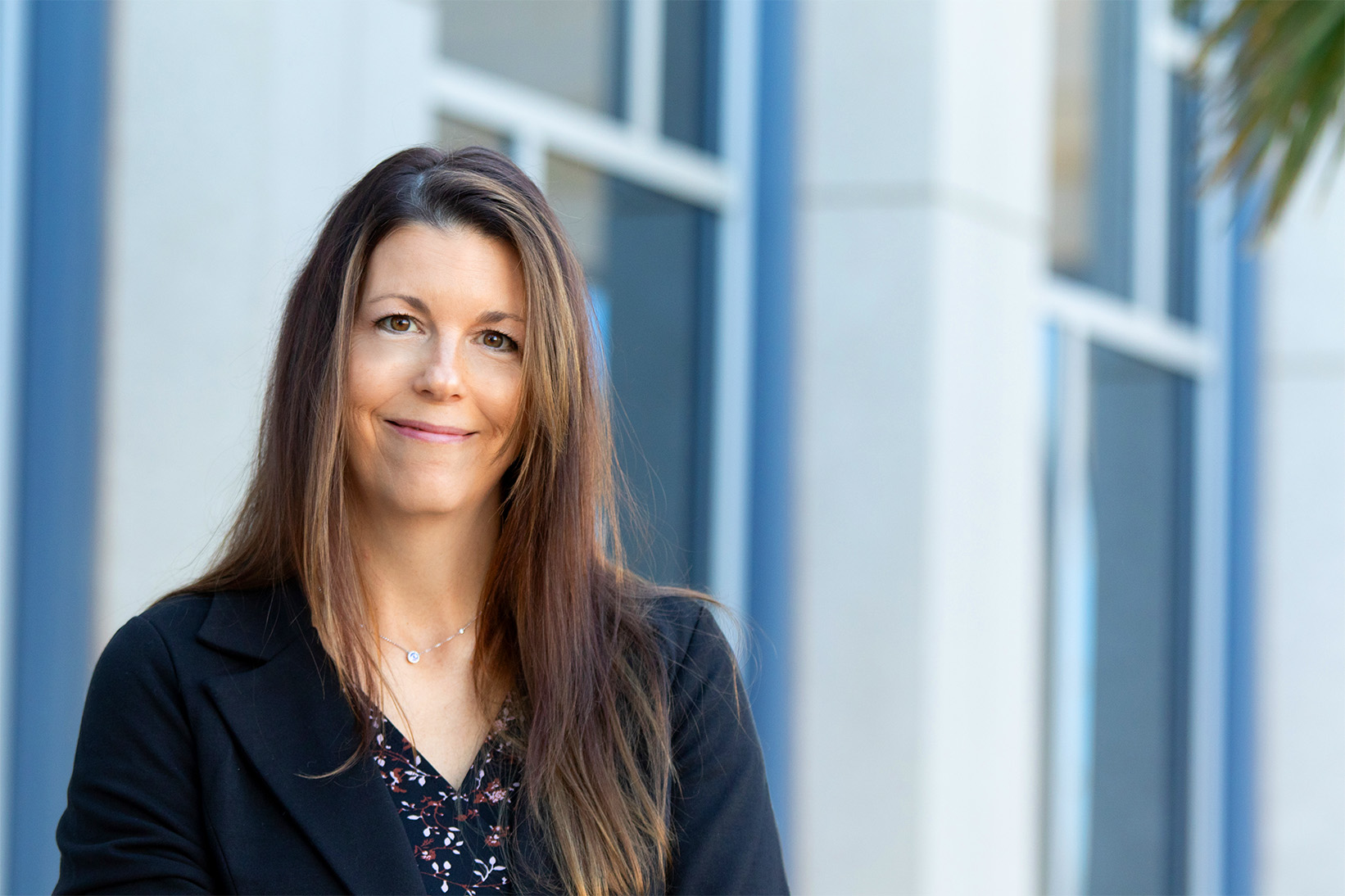 Lisa Cole smiling in front of a window